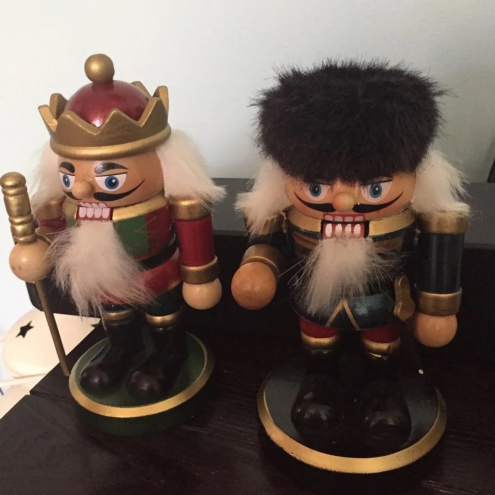 Nutcracker two with round wooden base.